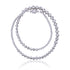A twisted silver beaded necklace with a graduated design, featuring varying sphere sizes. Can be worn in its twisted form for a layered look or untwisted for a sleek, minimal style.