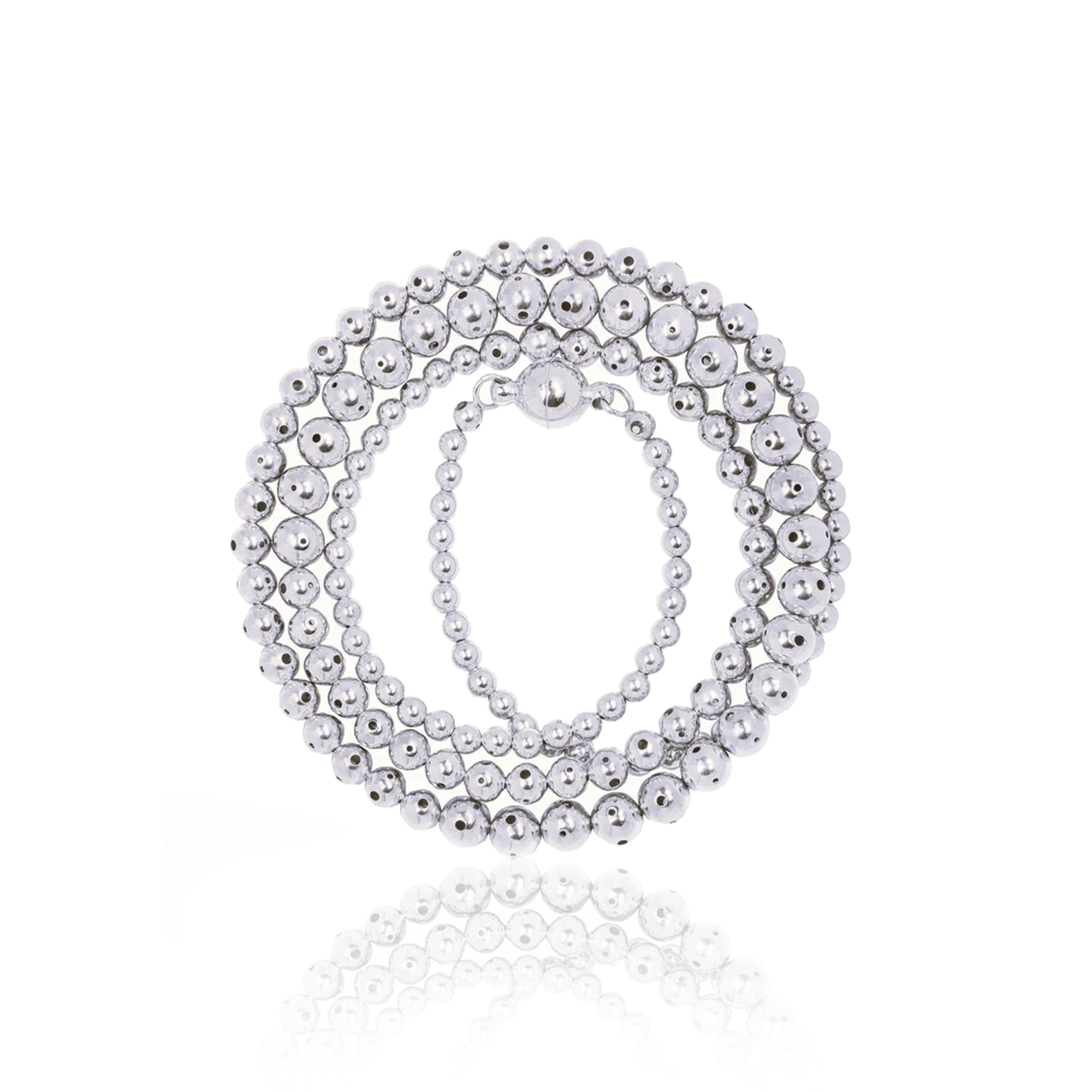 A silver beaded necklace twisted three times with a graduated design, featuring varying sphere sizes. Can be worn twisted in three different ways for a layered look or untwisted for a sleek, minimal style.