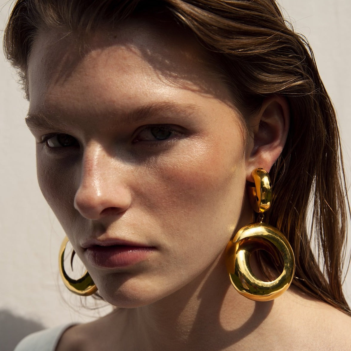 BLACK HOLE WITH HOOP EARRINGS