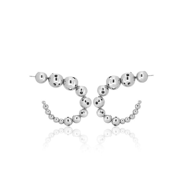 Pair of medium silver earrings featuring a curved design made of graduated metallic spheres.